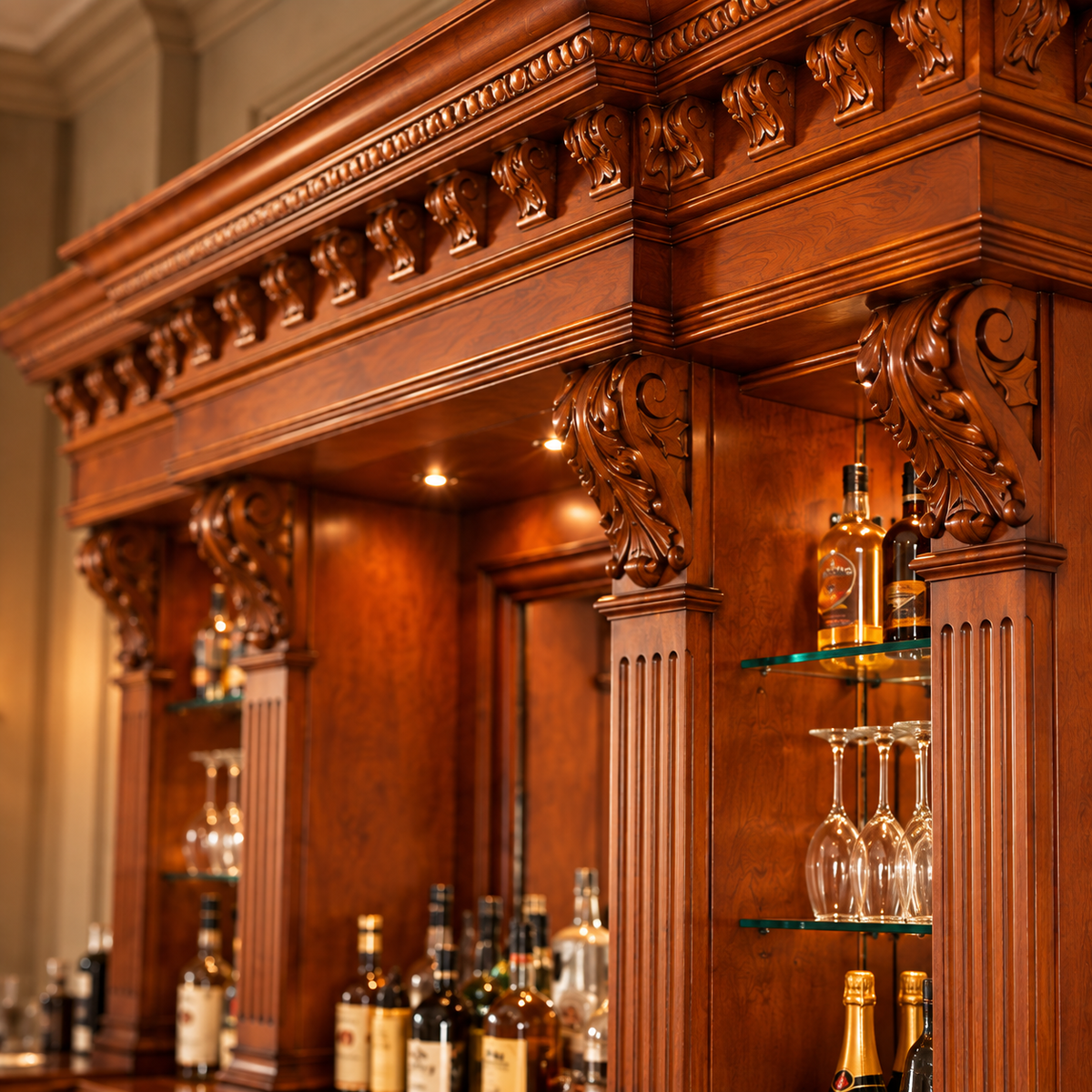 An ornate carved wooden bar cabinet with glass shelves holding bottles and wine glasses, photographed in a warm indoor setting.