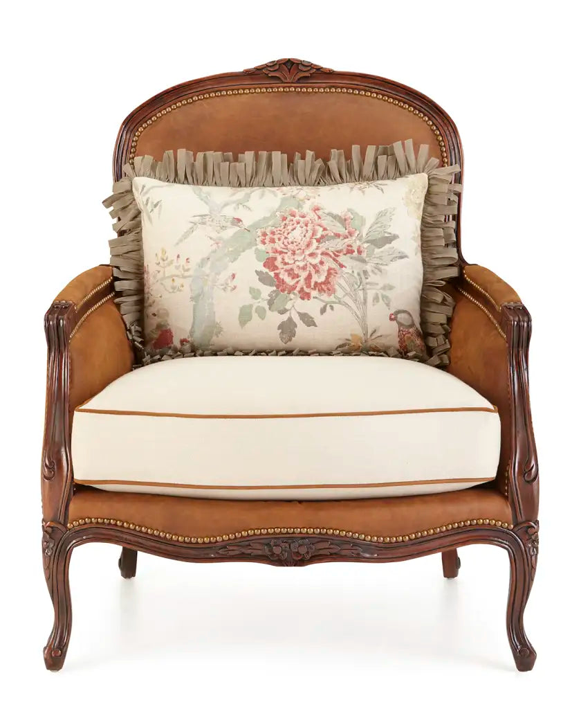 Decorative armchair with a floral pillow on a white background