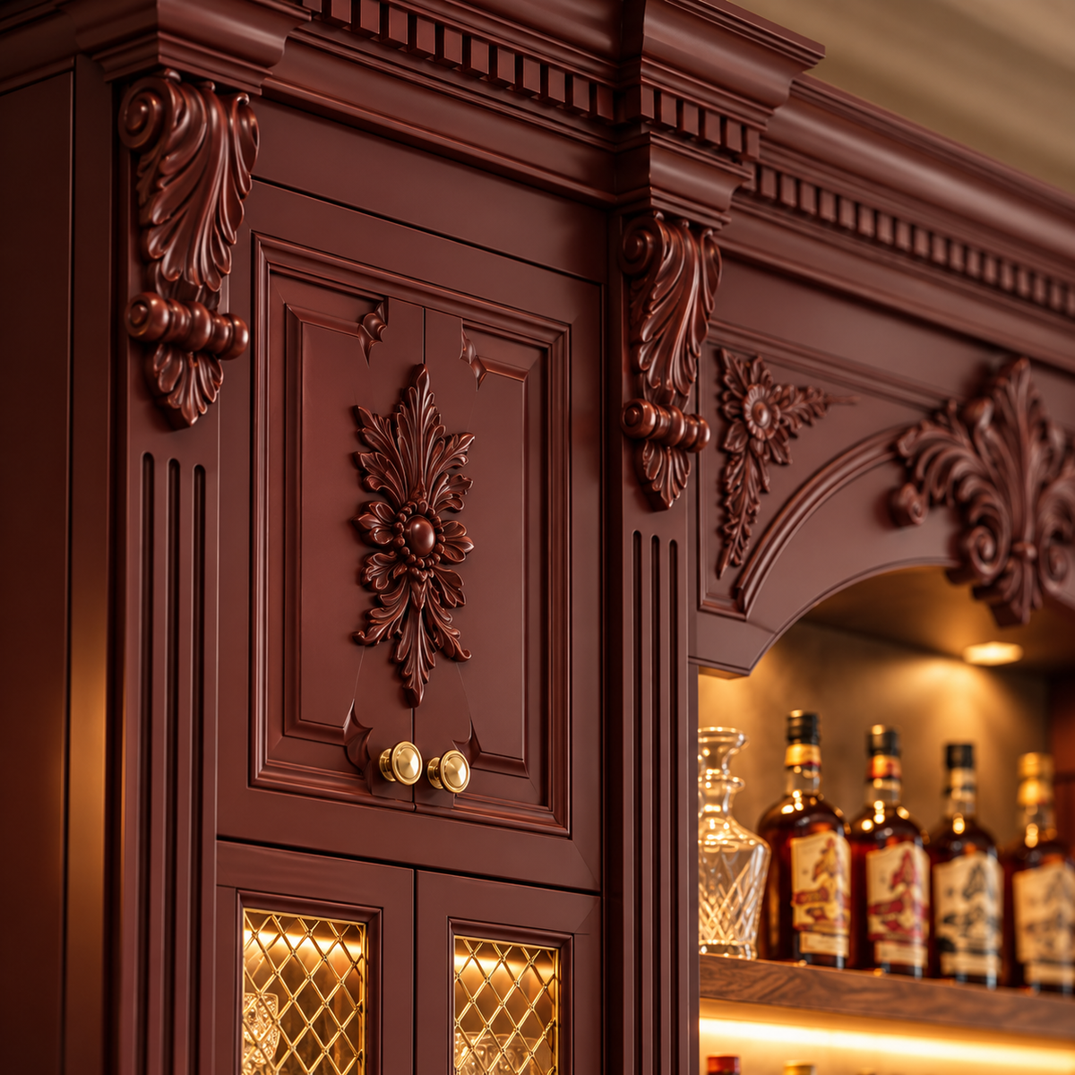 An ornate dark reddish-brown wooden cabinet with intricate carved floral details and gold-tone hardware, shown in a close-up interior view with warm lighting and bottles visible in the background.