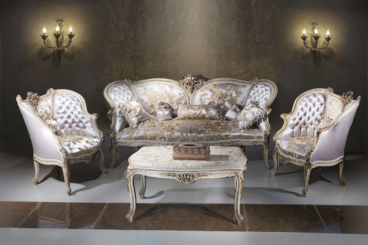 A luxurious Royal Blossom Satin Sofa Set with intricate carvings in antique gold, upholstered in floral satin fabric, alongside a matching center table with an Italian marble top.