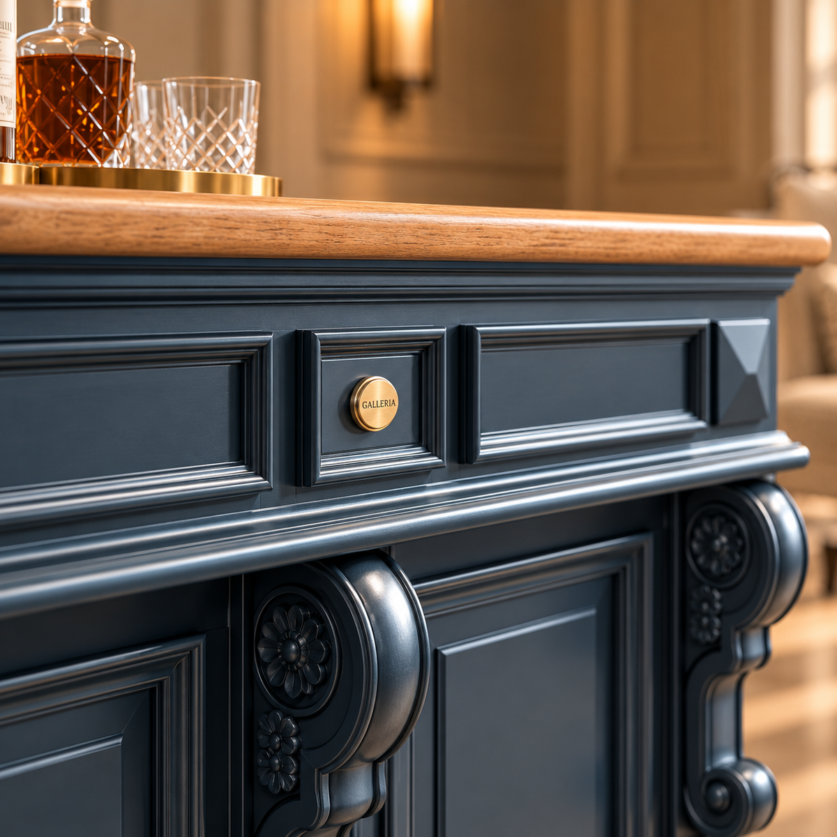 A close-up of a dark navy blue bar cabinet with ornate carved details, a light wood countertop, and brass hardware, set in a warm, elegant interior.