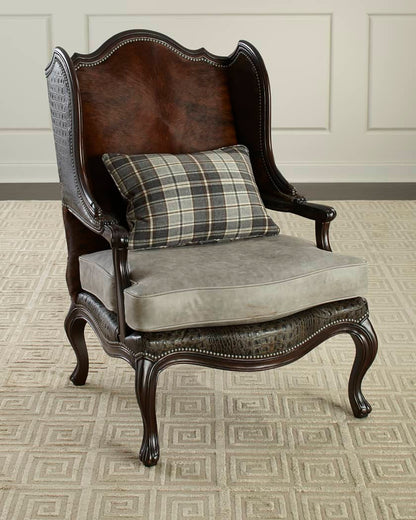 Decorative armchair with plaid pillow on a patterned floor