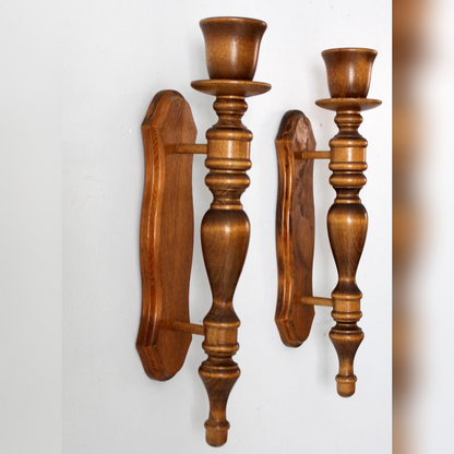 Pair of wooden wall sconces on a white background
