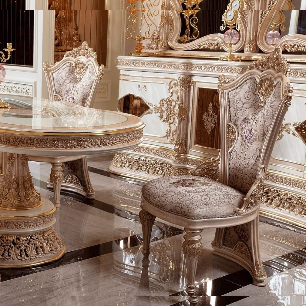 Luxurious dining set with ornate table and chairs in a reflective room.
