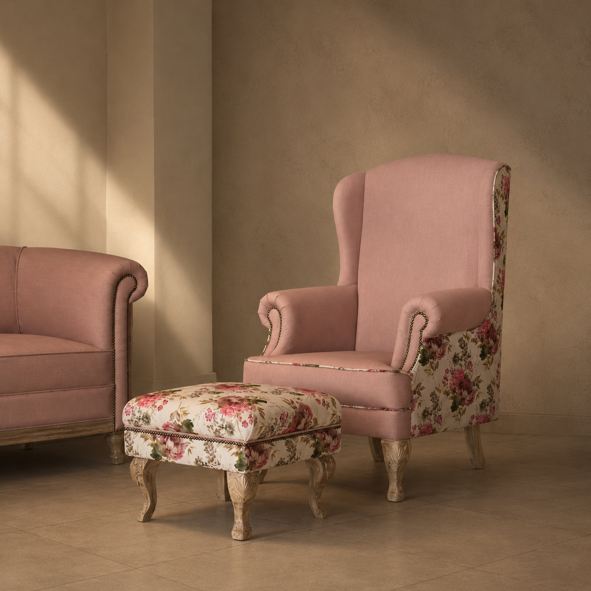 Pink armchair and ottoman with floral patterns in a room with beige walls and floor.