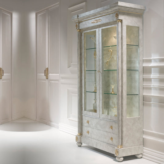 An elegant Ivory and Gold Display Closet with glass shelves, showcasing a refined appearance with a wallpaper finish in ivory and gold accents.