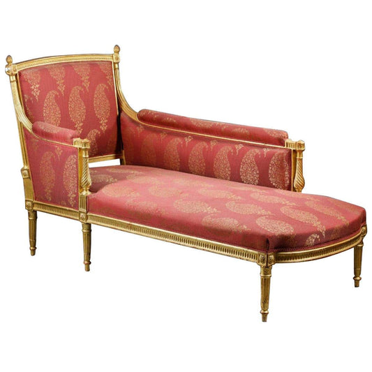 A red jacquard fabric divan with gold floral patterns and a gold frame.