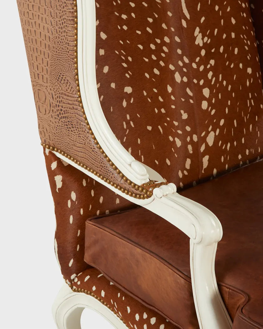 Brown chair with white speckled pattern on a white background