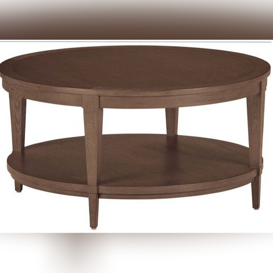 Wooden round coffee table with a shelf on a white background