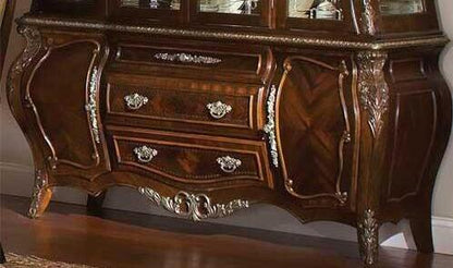 Decorative wooden dresser with intricate carvings and reflective surface