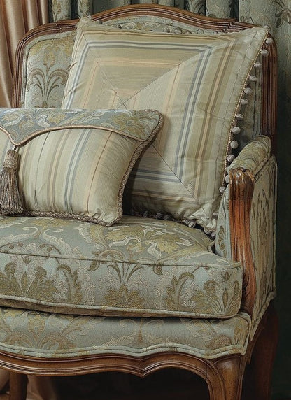 Decorative armchair with patterned cushions and wooden frame