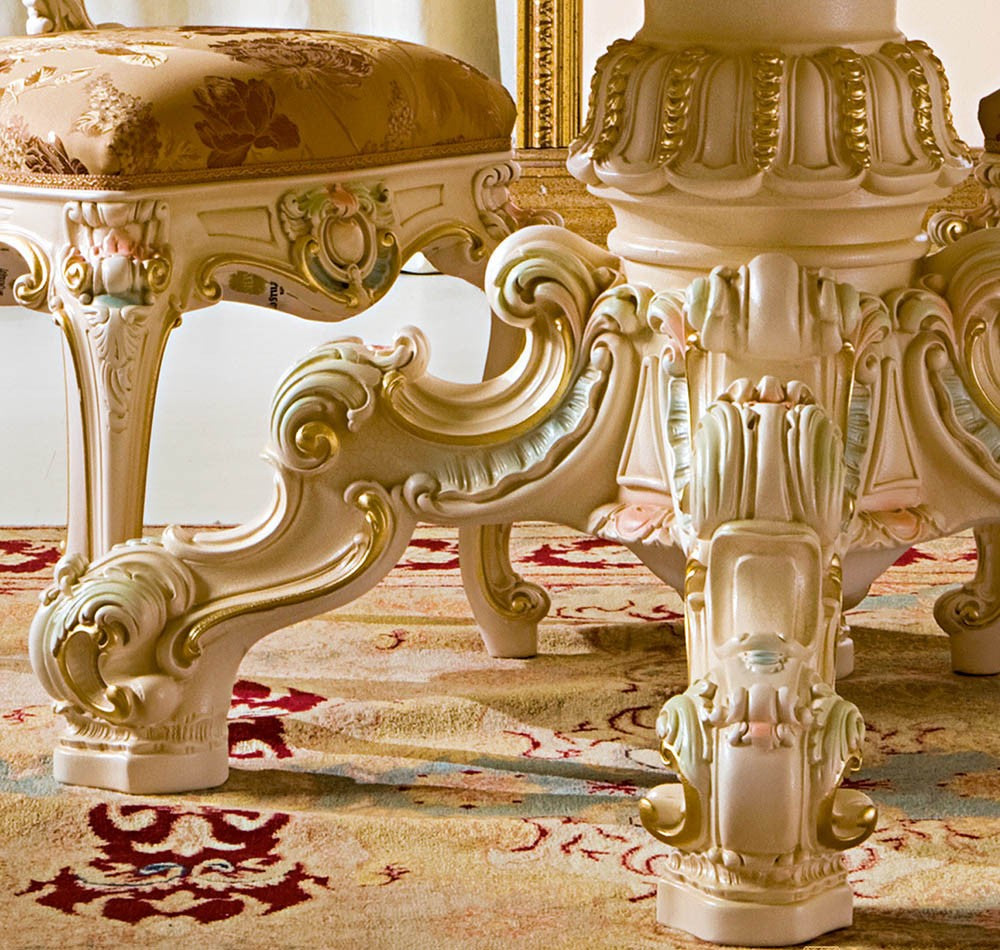 Decorative table with intricate carvings on a patterned rug
