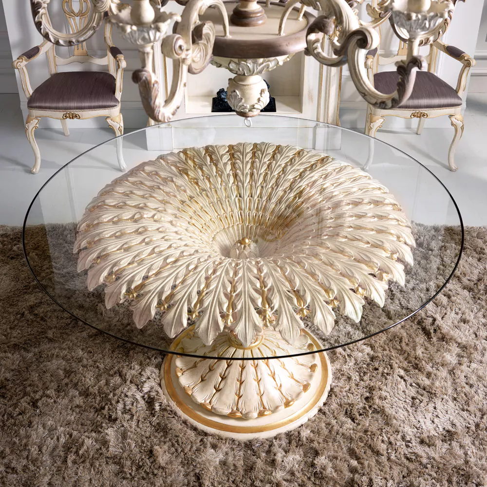 Decorative glass table with intricate design on a textured surface