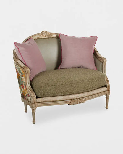 Vintage-style loveseat with pink cushions on a white background
