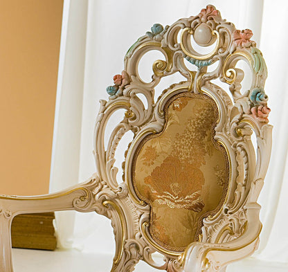 Decorative chair with intricate designs and a floral pattern on a white background