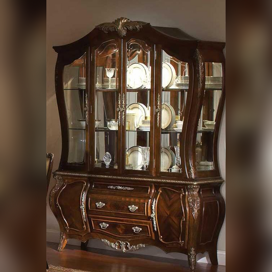 Wooden display cabinet with glass doors and decorative items inside, against a neutral wall.