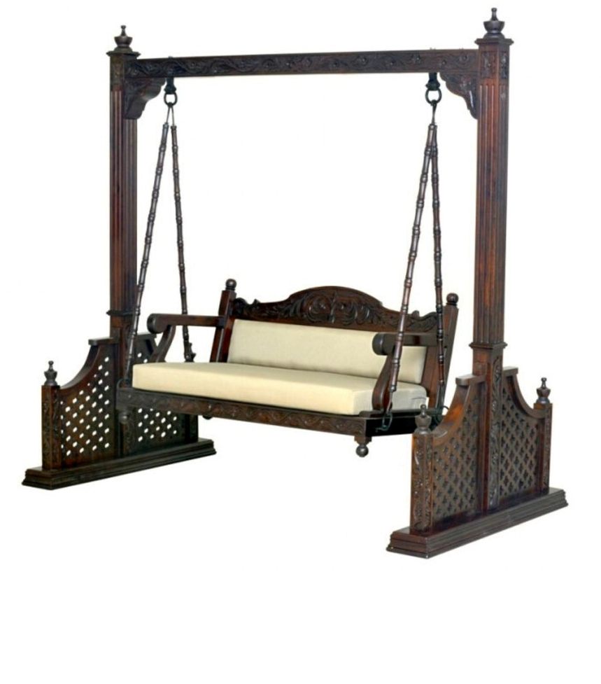 A handcrafted mahogany wood swing with plush beige embroidered fabric cushions and sturdy steel hangers, intended for indoor or outdoor use.