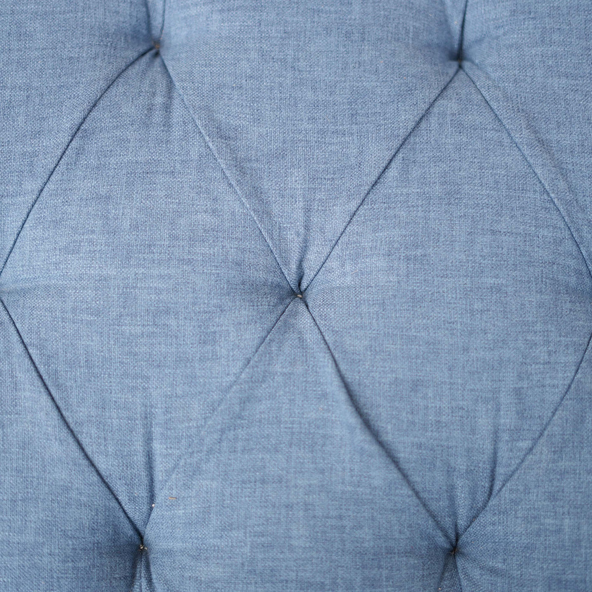 Close-up of a blue cushion with diamond pattern