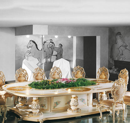 Decorative dining table with ornate chairs in a room with artistic wall pieces.