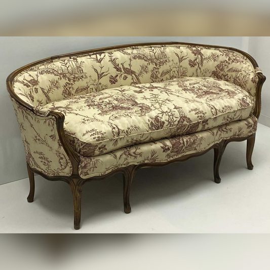 Vintage-style sofa with floral pattern on a white background
