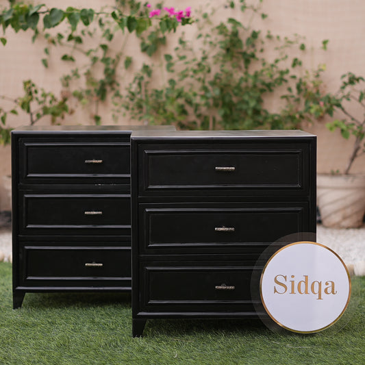 Black dresser with 'Sidqa' branding against a natural background