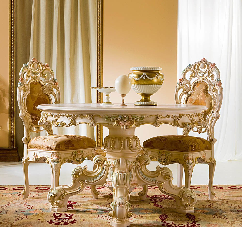 Ornate dining table and chairs in a room with decorative elements.