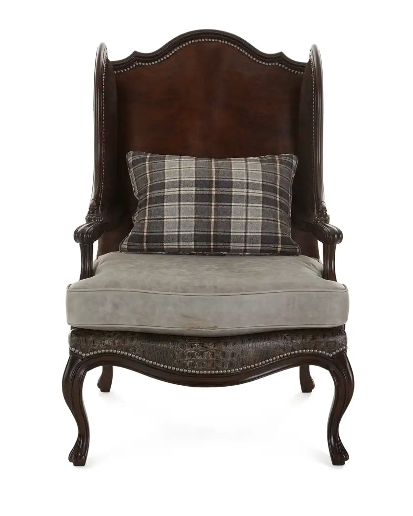 Decorative armchair with a plaid pillow on a white background