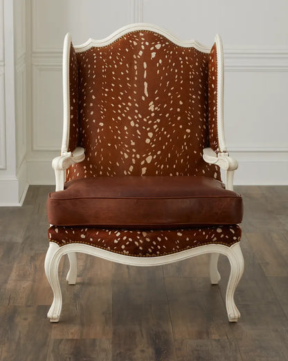 Chair with brown and white patterned backrest and seat on a wooden floor.