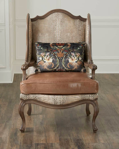 Decorative armchair with patterned backrest and brown cushion on a wooden floor.