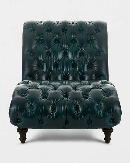Dark green leather armchair with tufted backrest on a white background