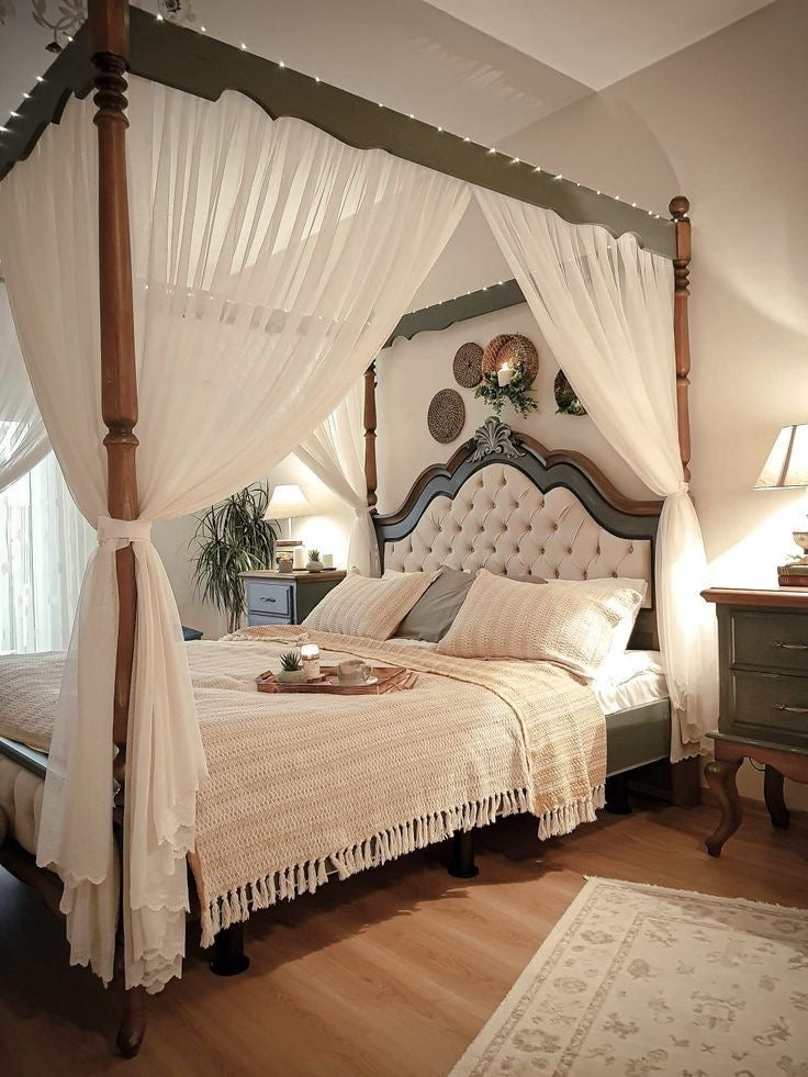 Bedroom with canopy bed, wooden headboard, and decorative pillows.