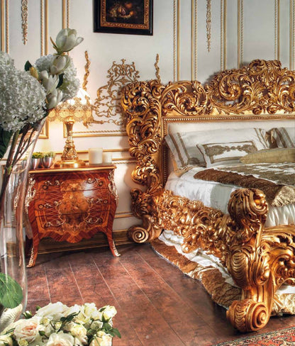 Luxurious bedroom with ornate gold bed and matching nightstand.