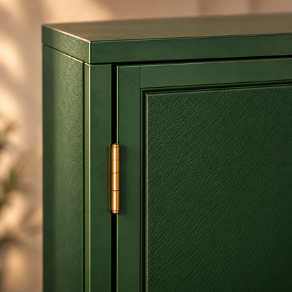 Close-up of a dark green cabinet door with a textured finish and a gold-toned hinge, shown against a softly blurred warm beige background.