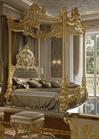 Luxurious bedroom with ornate gold canopy bed and detailed headboard.