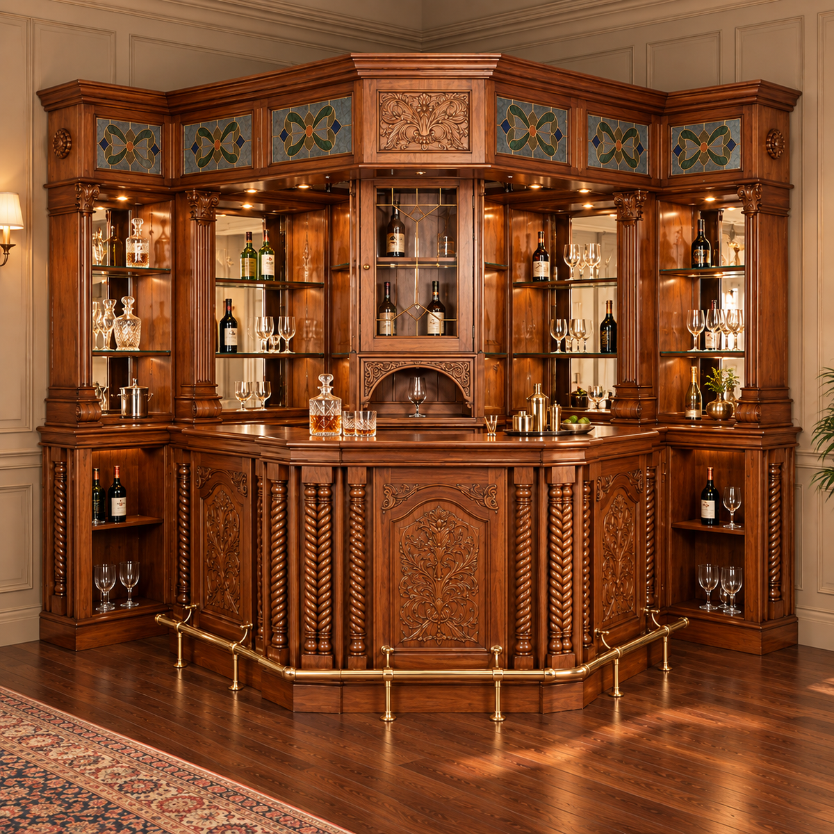 An ornate corner bar cabinet made of rich dark wood with intricate hand-carved details, built-in glass shelves stocked with bottles and glassware, brass bar rails, and decorative geometric tile panels, set in a classic room with wood floors and paneled walls.