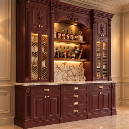 A large dark reddish-brown wooden bar hutch with gold-tone hardware, marble countertop, and illuminated shelves displaying bottles, set against an elegant cream paneled wall and tiled floor.