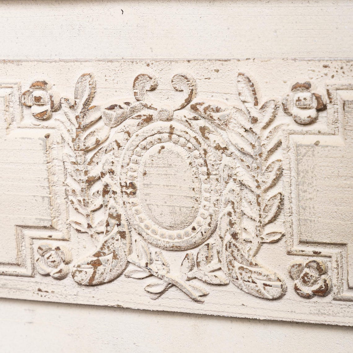 Decorative architectural detail with intricate patterns on a light background