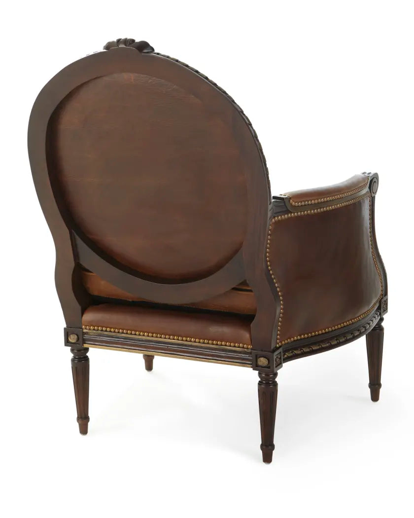 Brown leather armchair with decorative elements on a white background