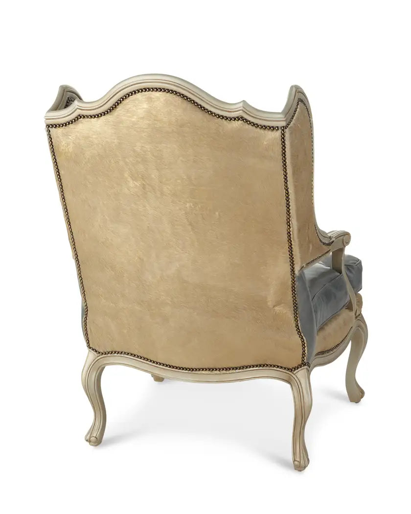 Decorative armchair with gold velvet upholstery on a white background