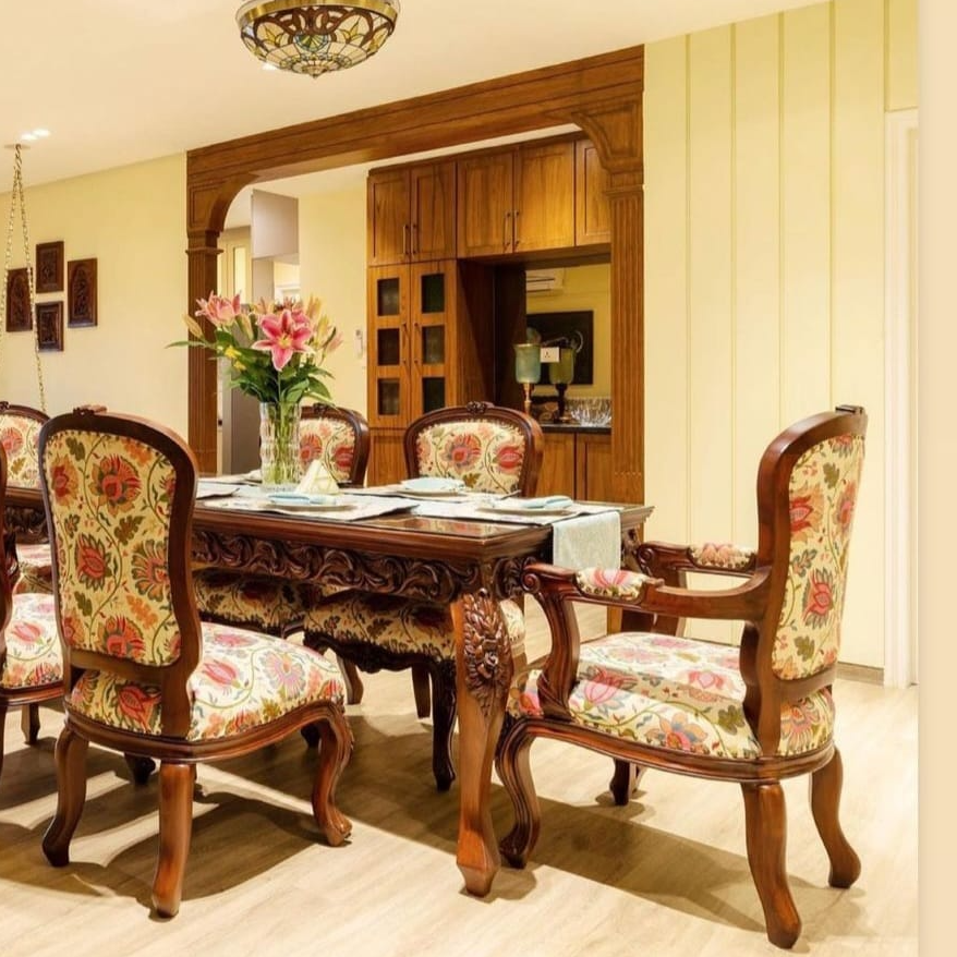 Dining room with wooden table and floral chairs