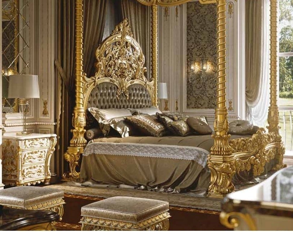Luxurious bedroom with ornate gold bed frame and matching headboard.