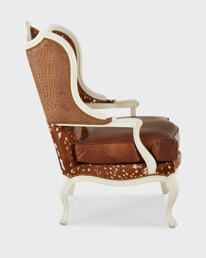 Decorative armchair with brown and white cowhide pattern on a white background