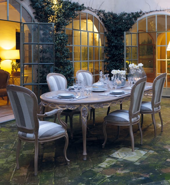 Dining table set with chairs in a stylish interior setting