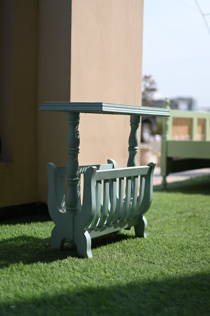 Gray chair on a grassy area with a blurred background