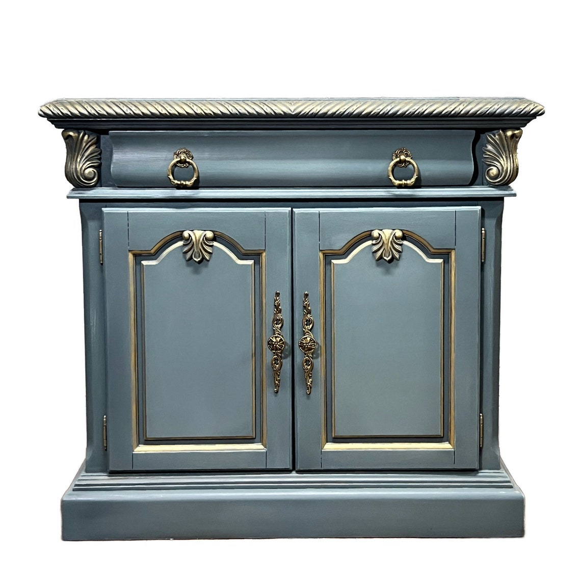 Gray cabinet with gold accents on a white background