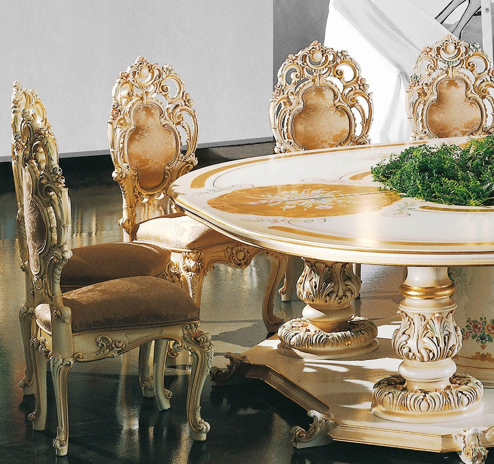 Decorative dining table and chairs with intricate designs in a room.