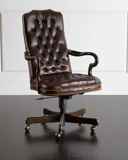 Brown leather office chair with tufted backrest on a reflective surface.