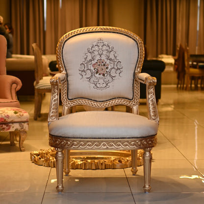 Decorative armchair with intricate design in a showroom setting