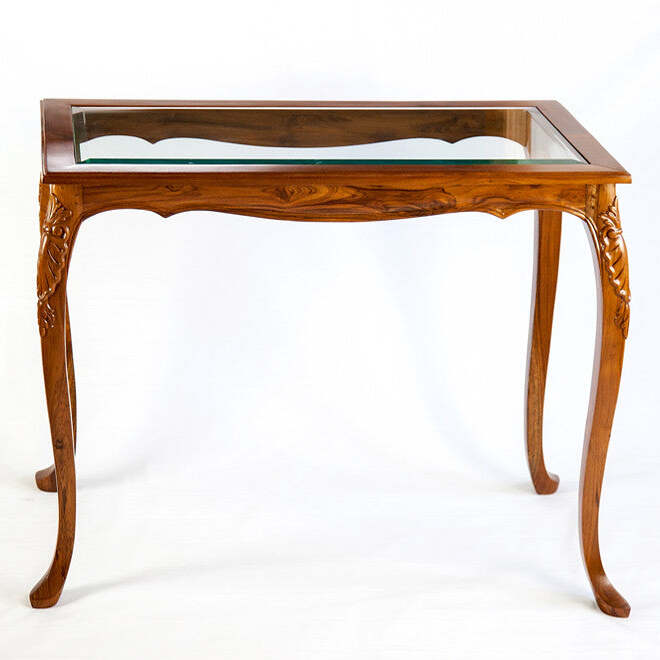 Wooden table with glass top on a white background