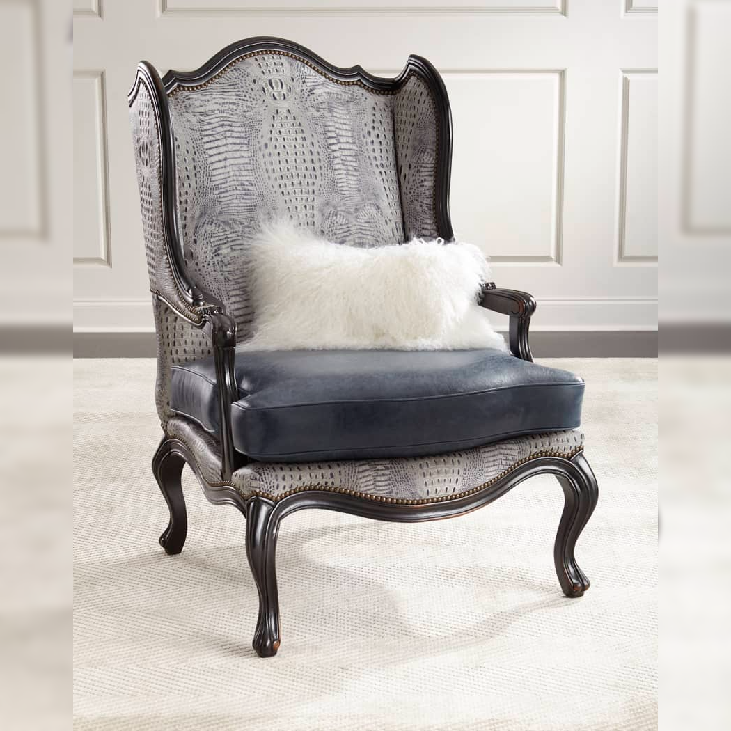 Decorative armchair with wicker backrest and blue cushion on a neutral background